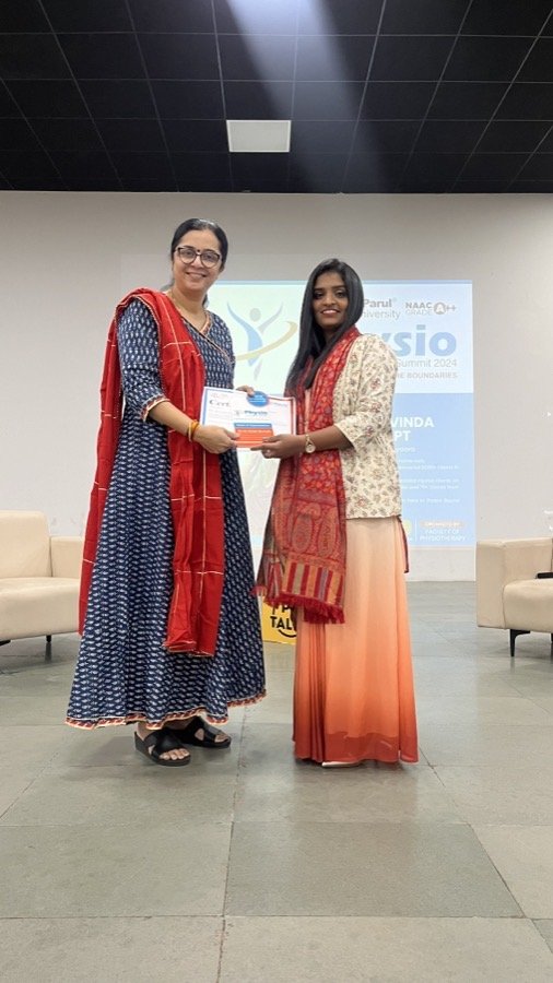 Dr. C S Aravinda receiving a recognition award at the Physio Summit 2024, Parul University